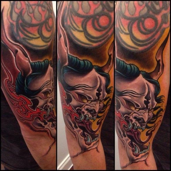 手臂亚洲风格的恶魔头像纹身图案